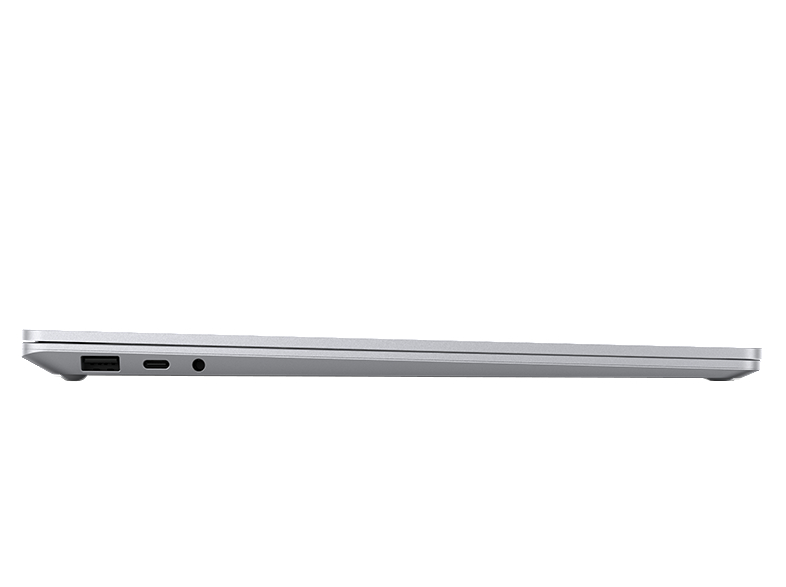 Seitenansicht eines geschlossenen silbernen Laptops mit sichtbaren Anschlüssen gegen einen weißen Hintergrund.
