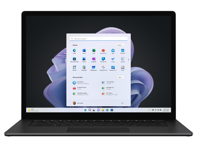 Ein Laptop mit einem Windows 11 Startmenü. Der Laptop ist schwarz, der Hintergrund dunkelviolett.