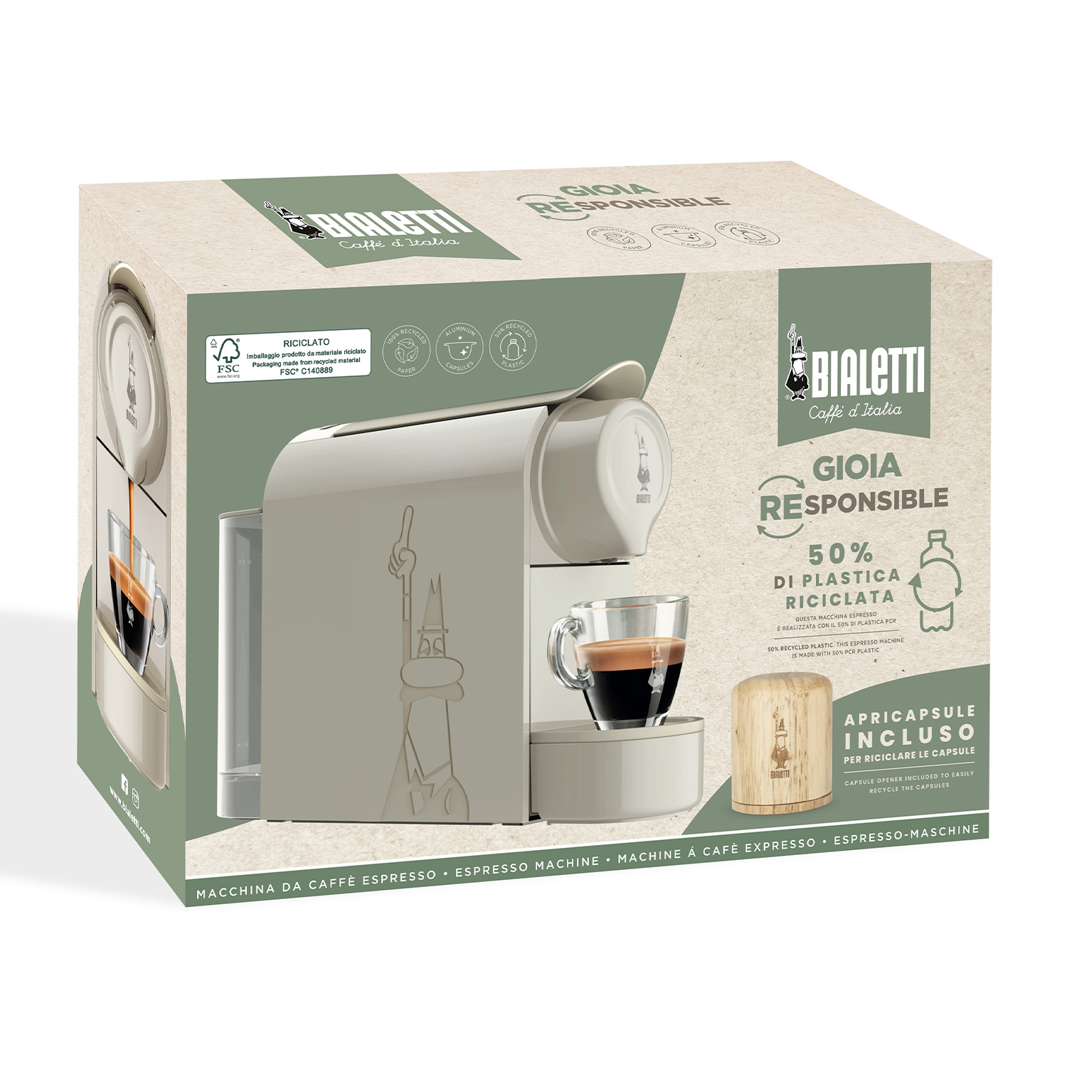 Una scatola di macchina da caffè con macchina da caffè, tazza e capsule.