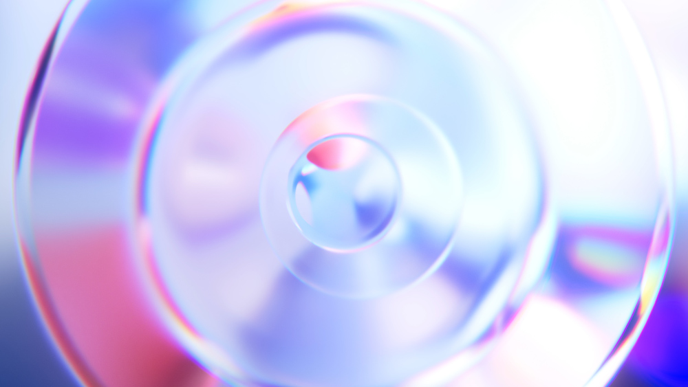 Image abstraite de cercles concentriques. Les couleurs incluent le violet, le bleu et le rose.