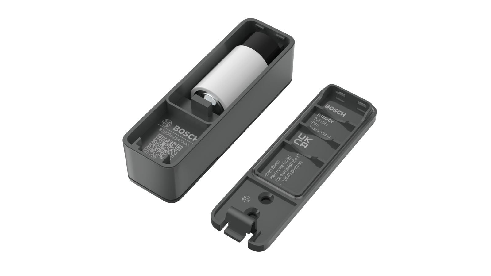 Zwei Teile eines schwarzen Geräts mit einer Batterie im Inneren sind getrennt.