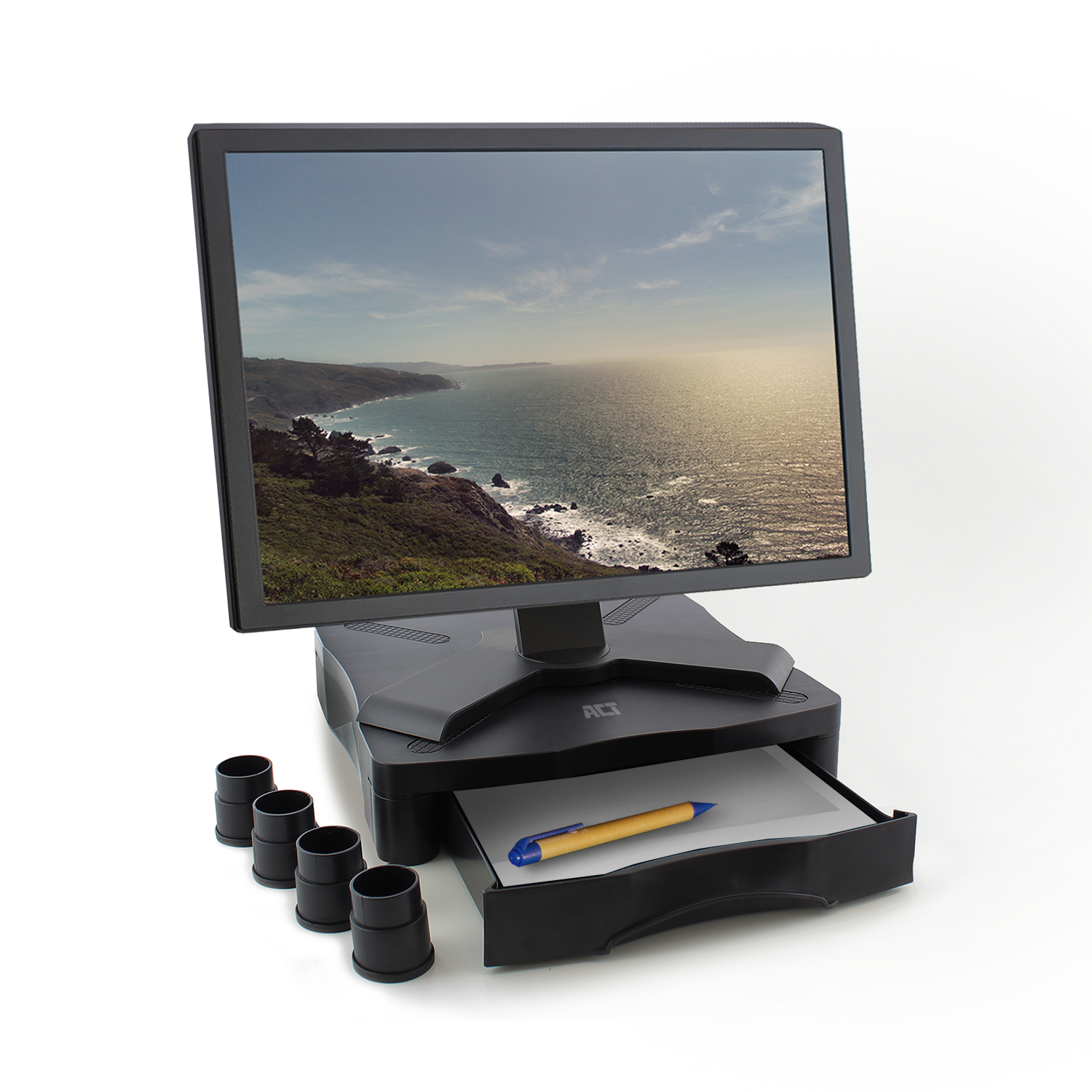 Monitor on a stand with a pen and a drawer. A scenic view is displayed on the screen.