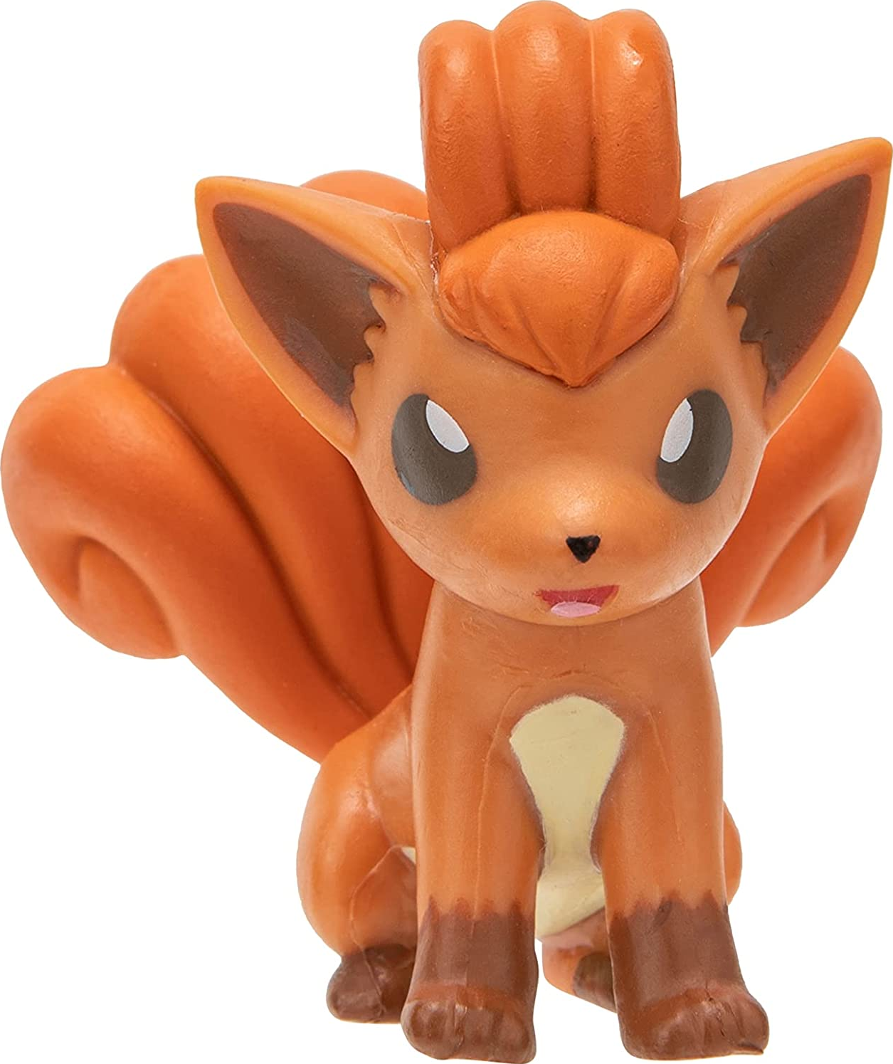 Une figurine de Vulpix Pokémon, orange avec des yeux sombres et une petite langue rose.