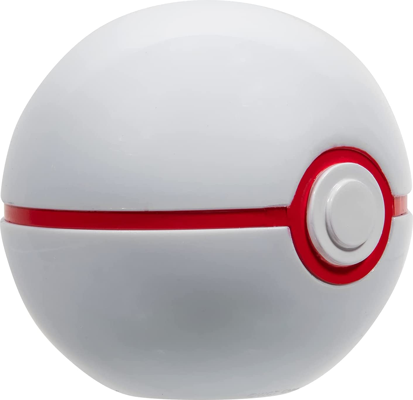 Un jouet Pokeball blanc et rouge avec une bande rouge au milieu.