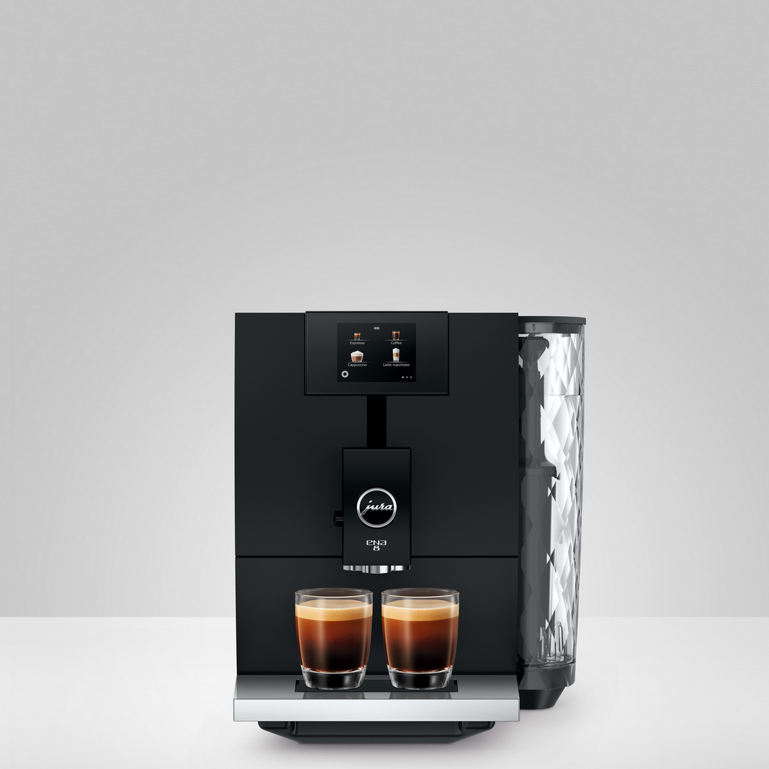 Black Jura coffee machine with two glasses of coffee. The machine has a touch screen, and a water tank.