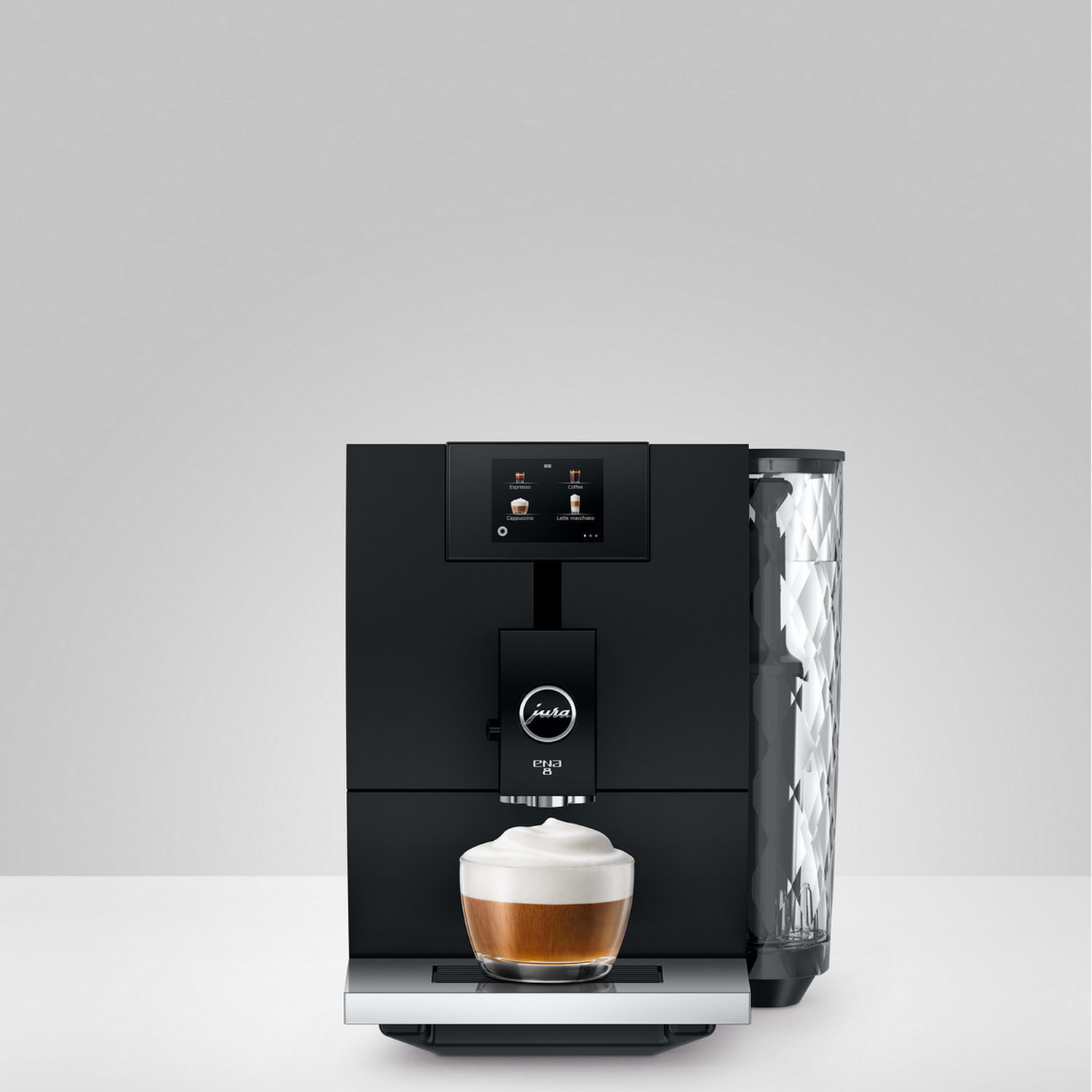 Black espresso machine with a cup of espresso, transparent water container, white background.