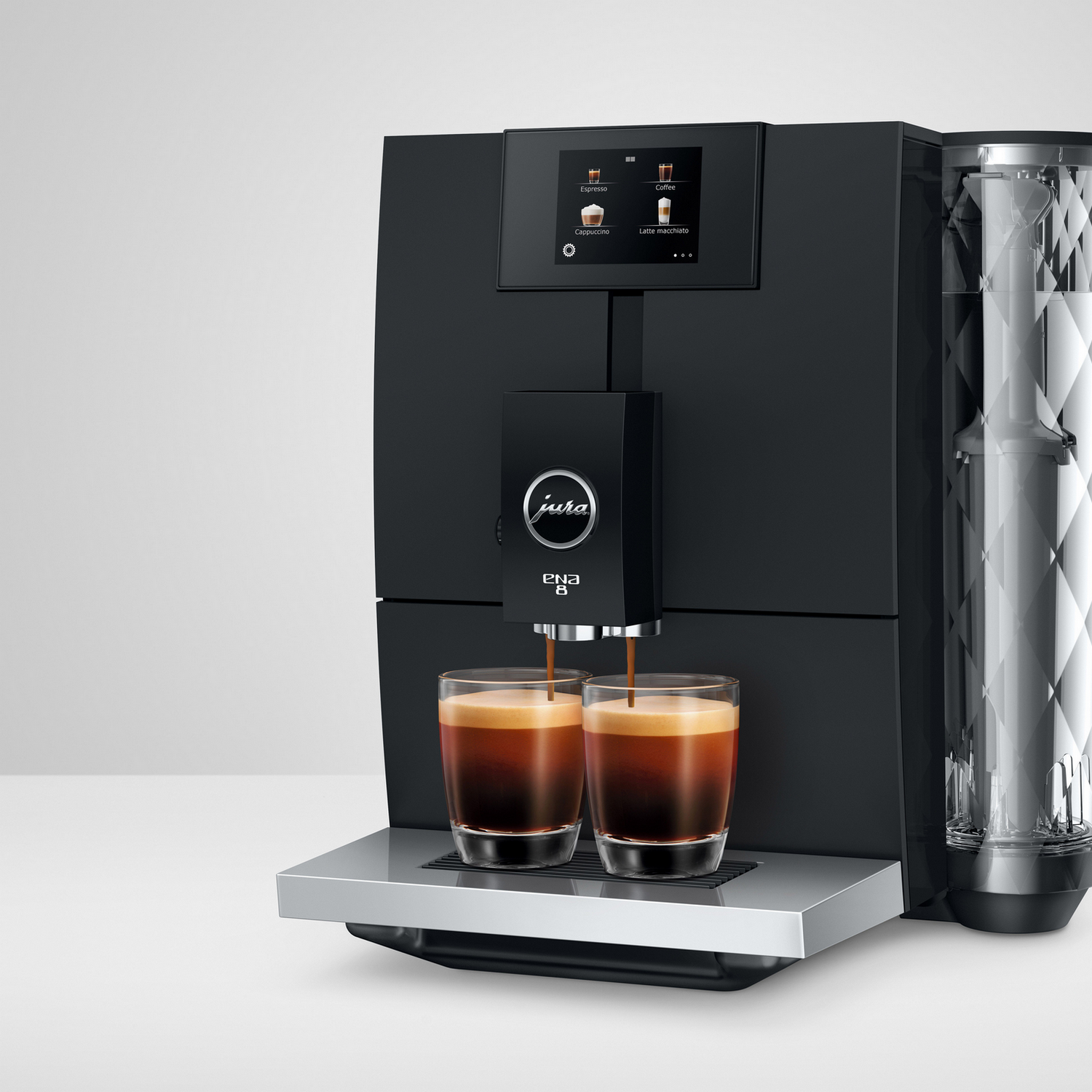 Black Jura ENA 8 coffee machine dispensing coffee into two glasses.
