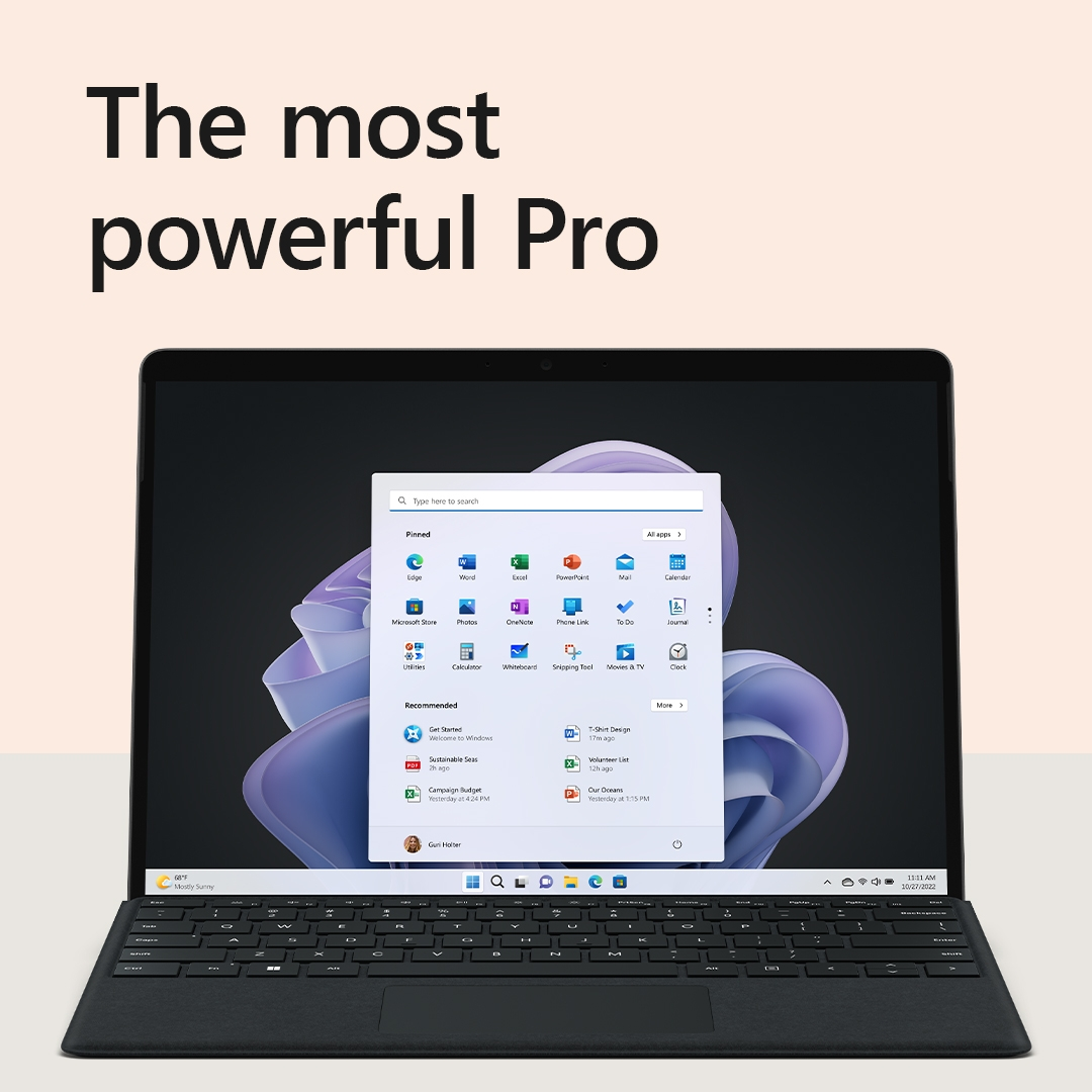 Laptop auf einem Tisch, der eine Windows 11-Oberfläche anzeigt. Der Text 'The most powerful Pro' steht oben.