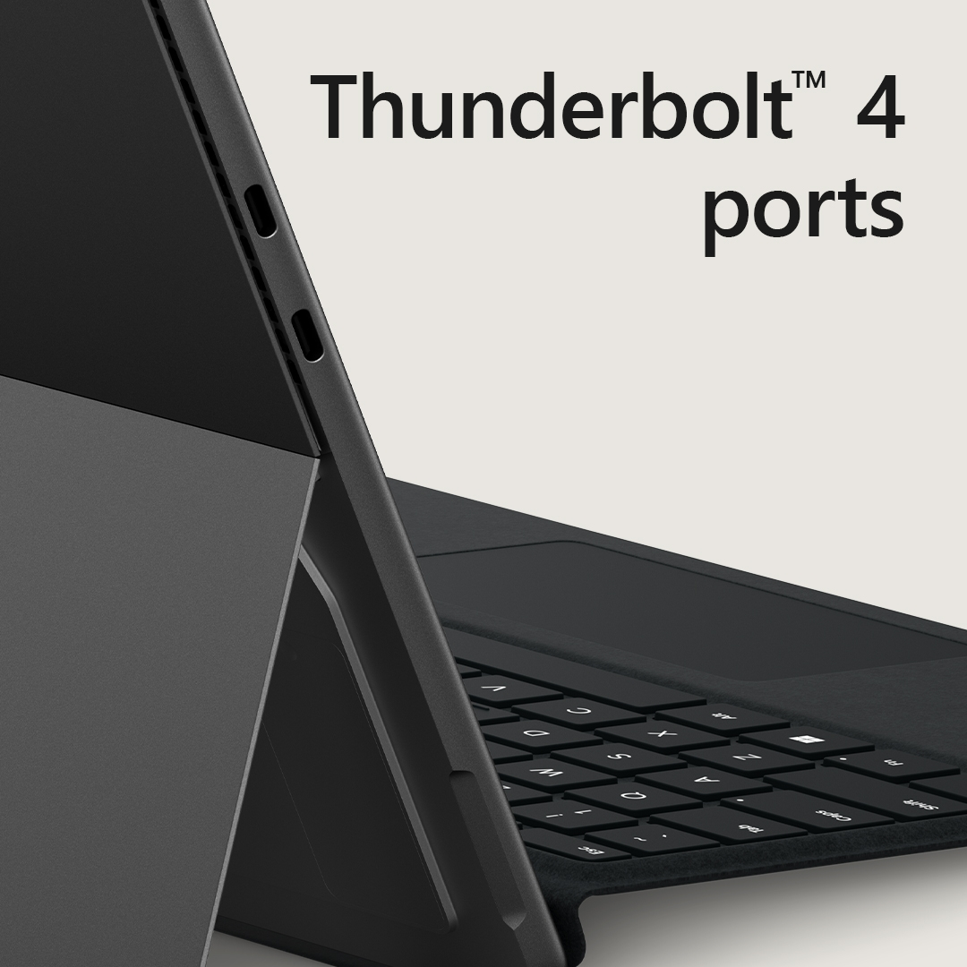 Ein Laptop mit Tastatur und dem Text „Thunderbolt 4 ports“. Der Laptop ist schwarz und hat eine dunkelgraue Abdeckung.