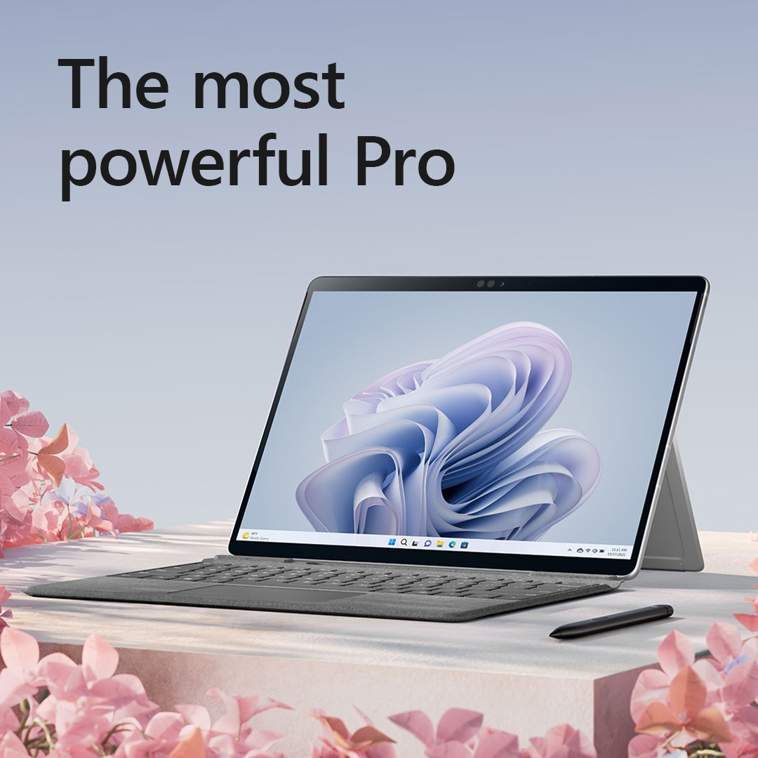 Ein Tablet mit Tastatur und Stift auf hellrosa Oberfläche, mit dem Text 'The most powerful Pro'.
