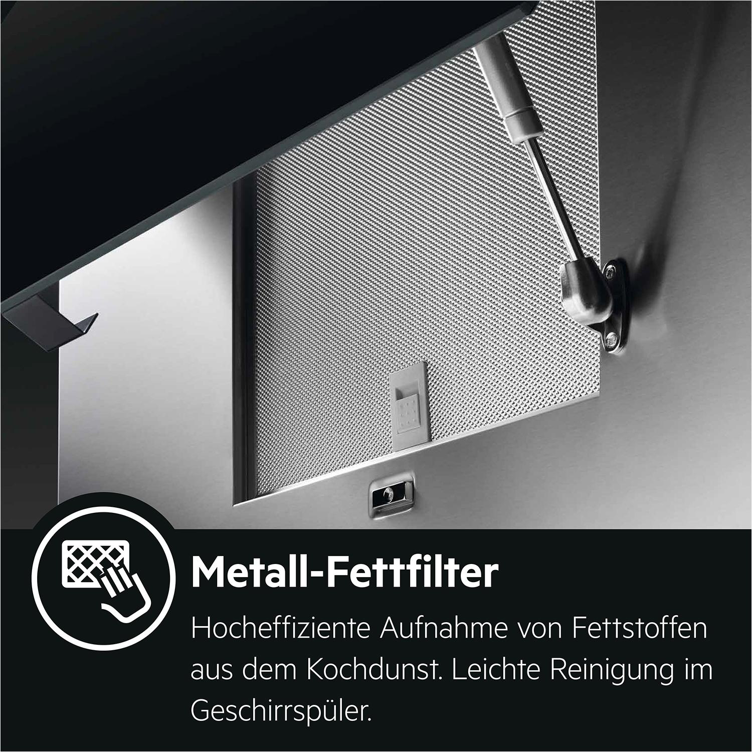 Metallfettfilter einer Dunstabzugshaube mit Text darunter.