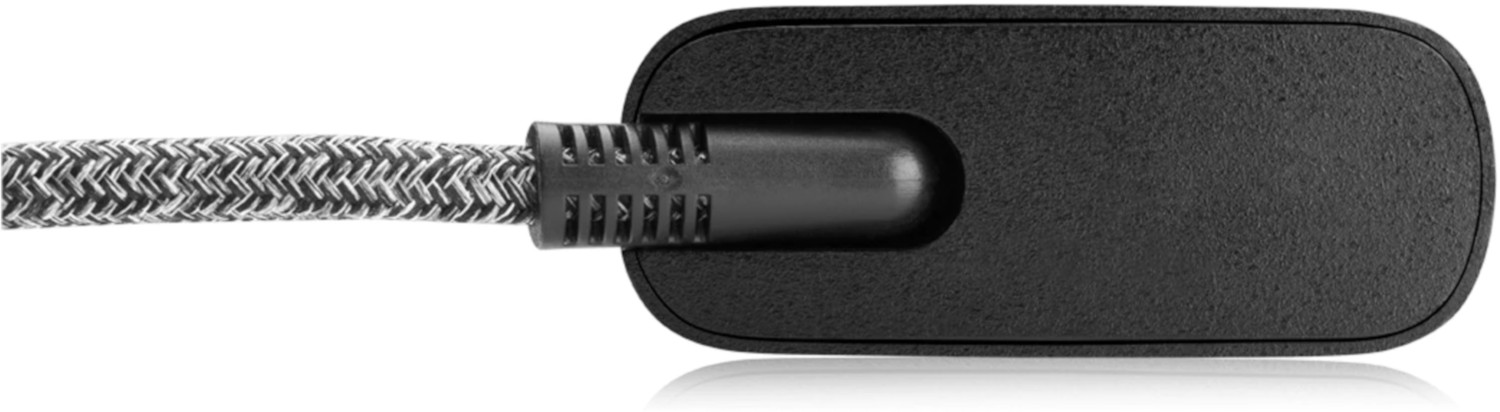 Black, rectangular adapter with a braided cable, isolated on a white background.