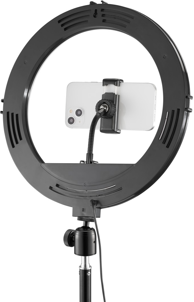 Ein schwarzer Ringlicht mit einem Telefon, eingerichtet für Videoaufnahmen.
