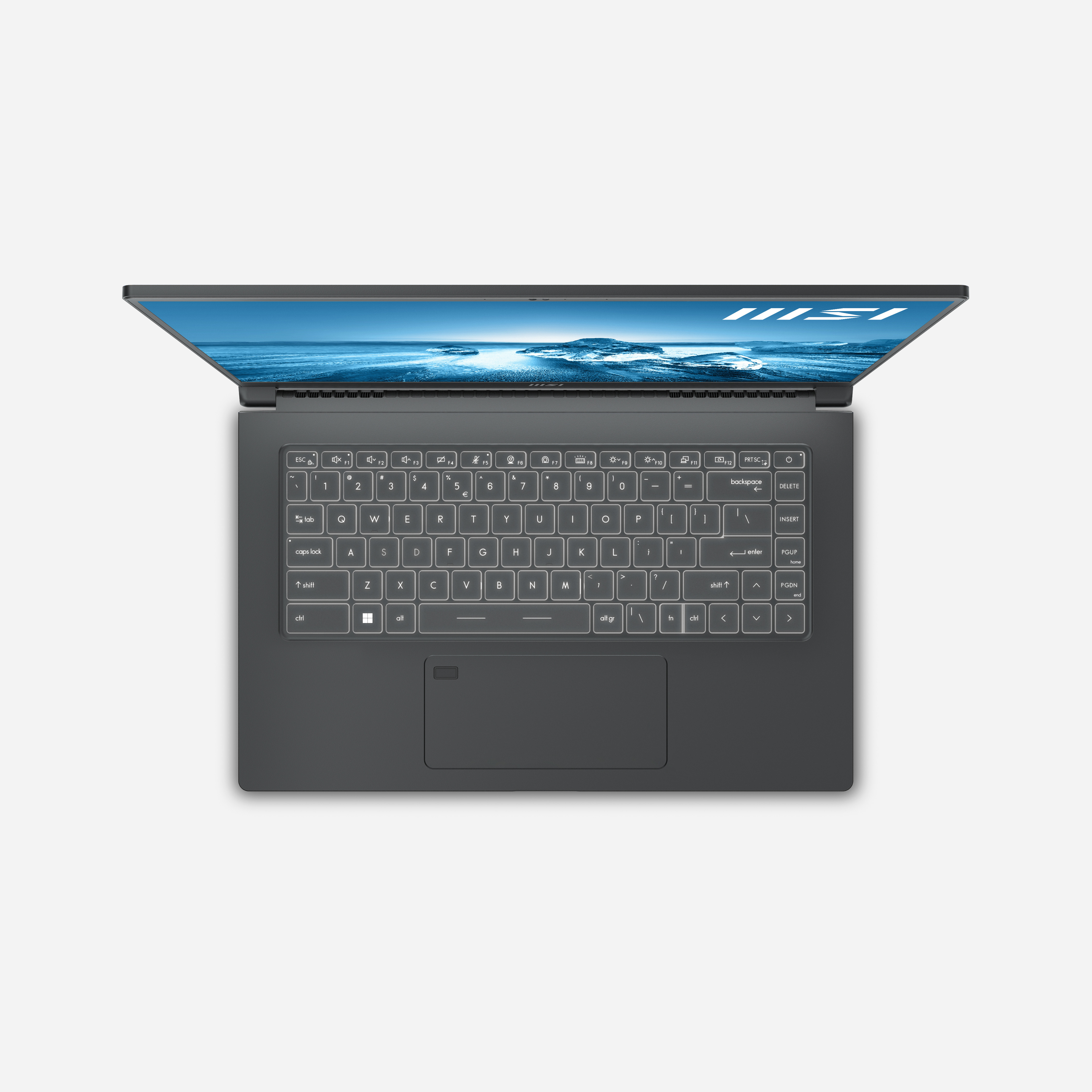 Vista superior de una laptop abierta sobre un fondo blanco, el teclado en foco.