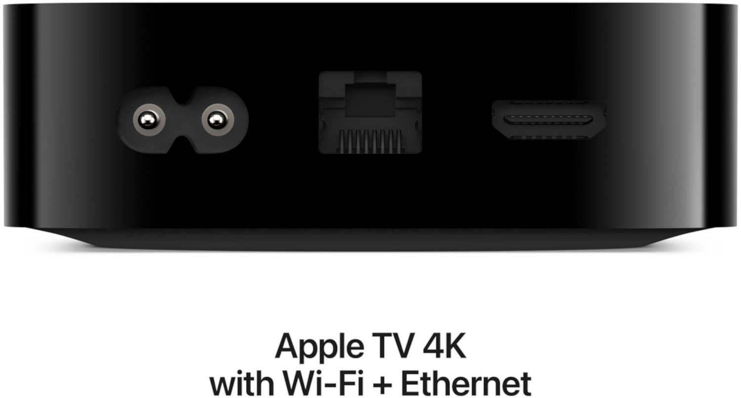 Apple TV 4K with Wi-Fi and Ethernet ports, on a black surface, rear view.
