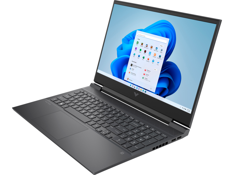 Laptop negro, pantalla mostrando la interfaz de Windows, vista angular.
