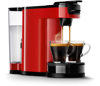 Rode koffiemachine met twee kopjes koffie die worden geschonken.