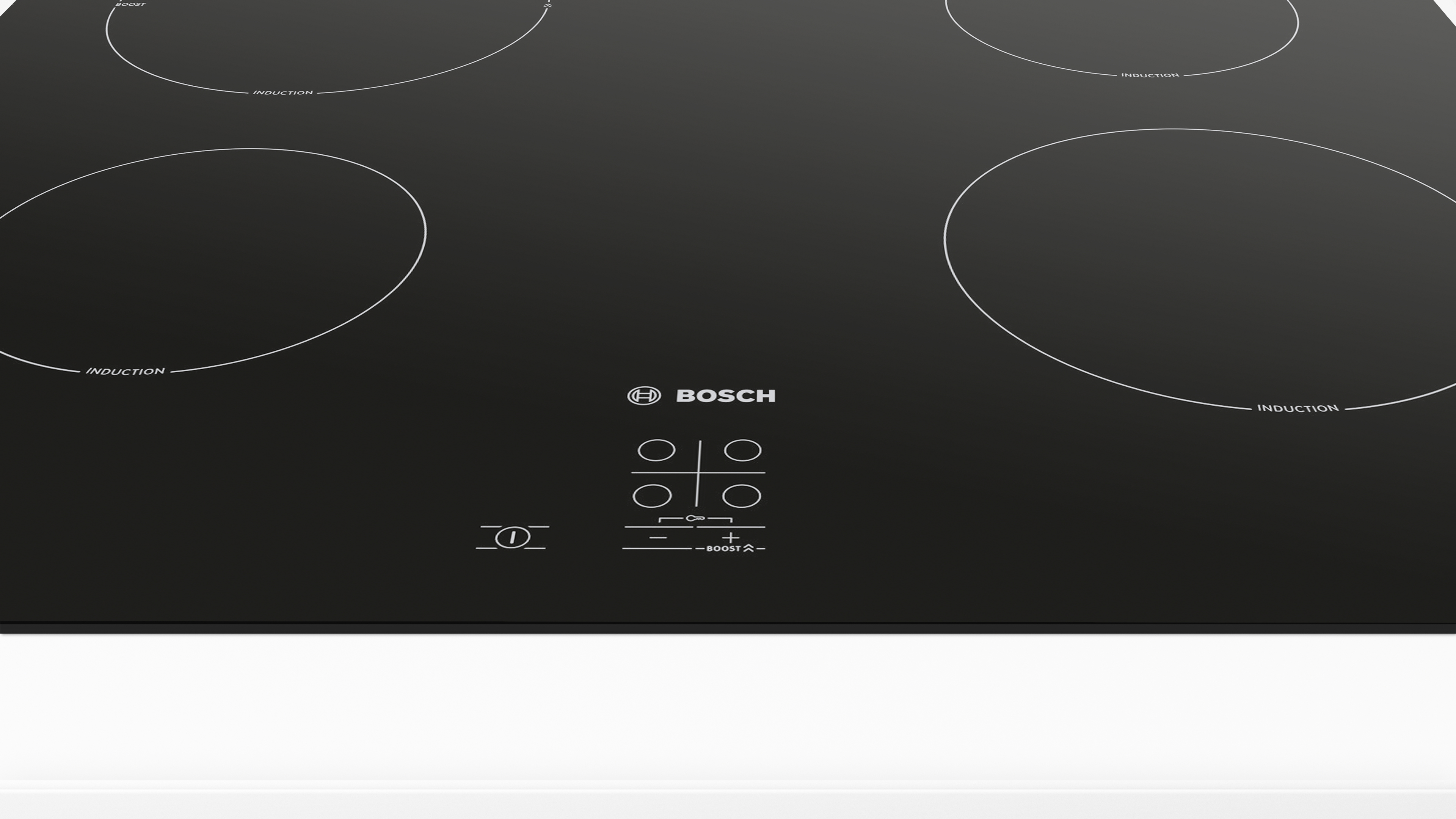 Black induction hob with four cooking zones and touch controls. The Bosch logo is centered.