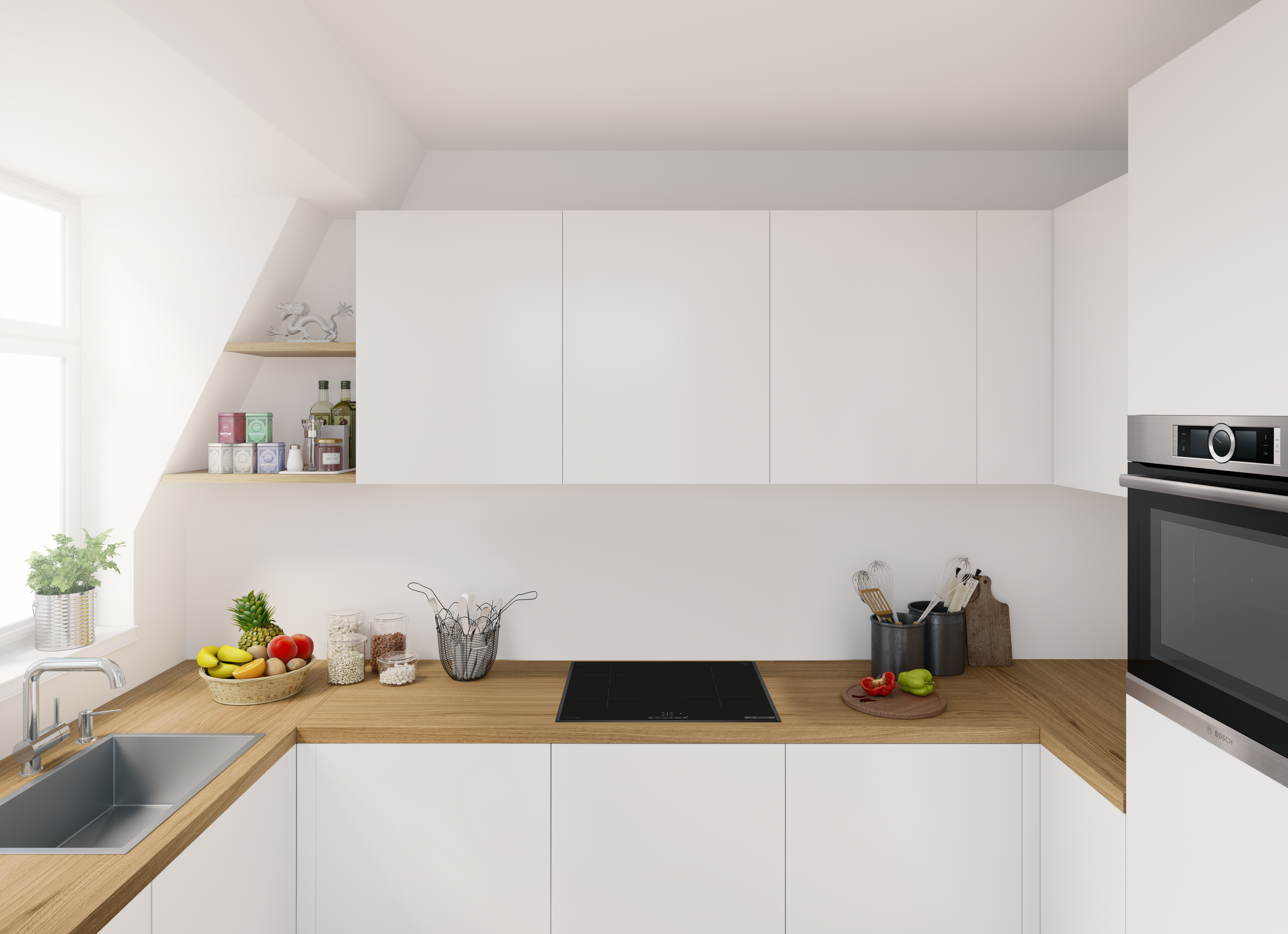 Modern kitchen with white cabinets, wooden countertops, and a built-in oven. Fruits and utensils are on the counter.