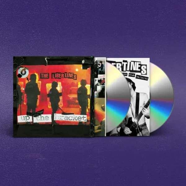Albumcover und zwei CDs. Schwarzes Albumcover mit Bandnamen. CDs sind silber mit bunten Reflexen.