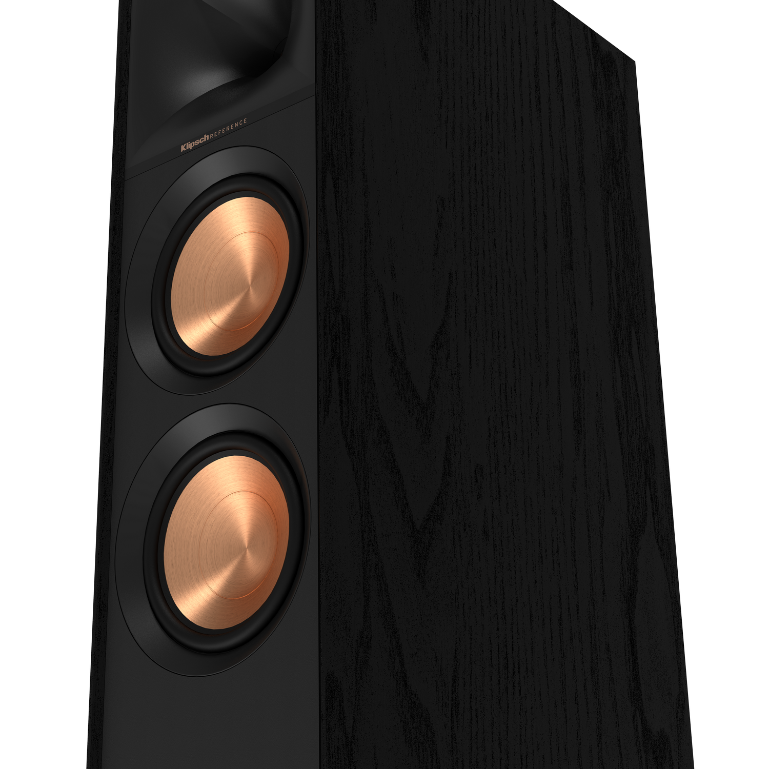 A black speaker, with copper colored cones, on a black wooden surface.
