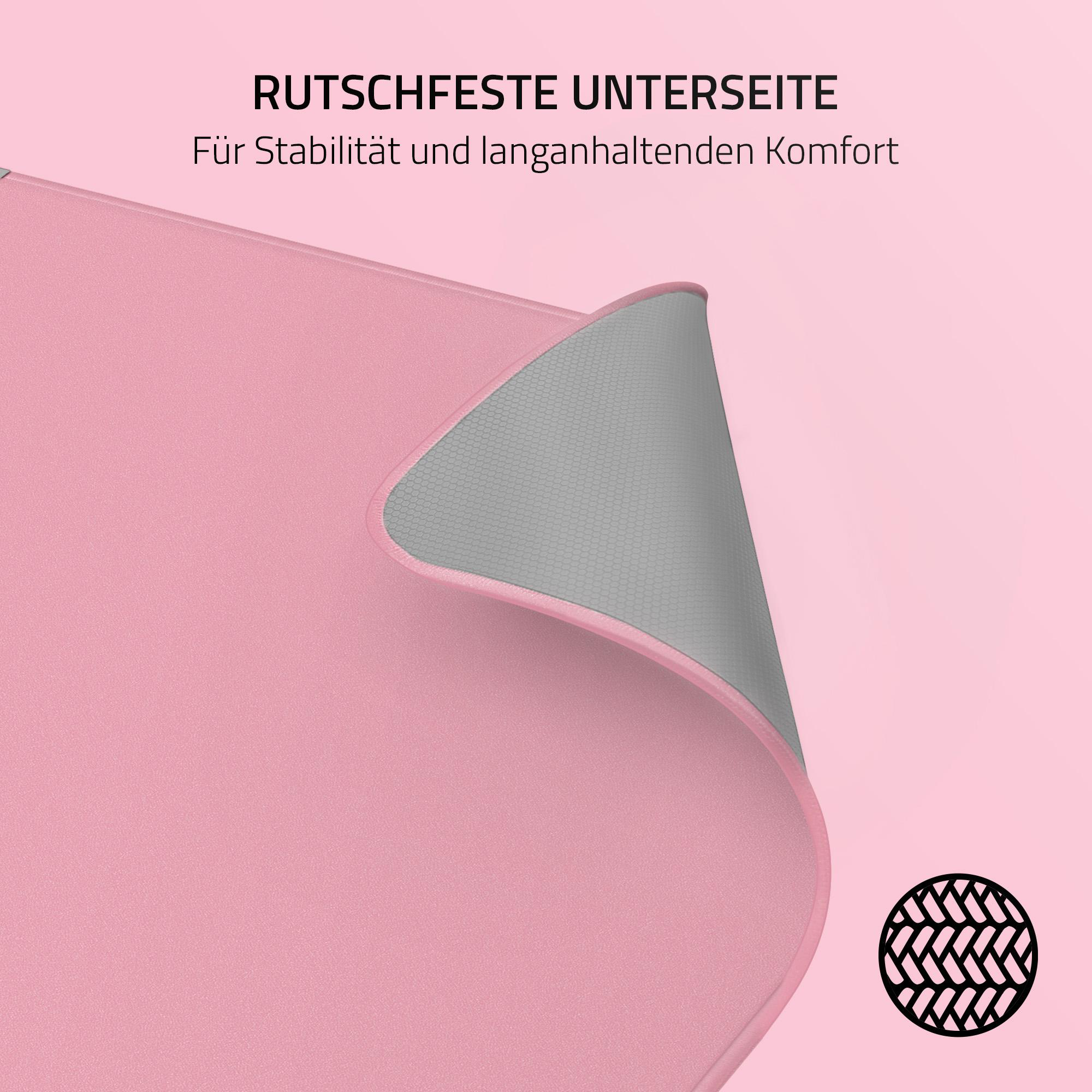Rosa Mauspads mit grauer Unterseite und einem schwarzen Muster. Der Text lautet: RUTSCHFESTE UNTERSEITE.