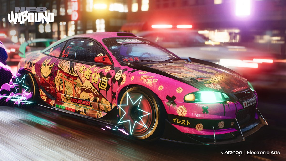 Pink custom car with anime design, racing on a city street at night.