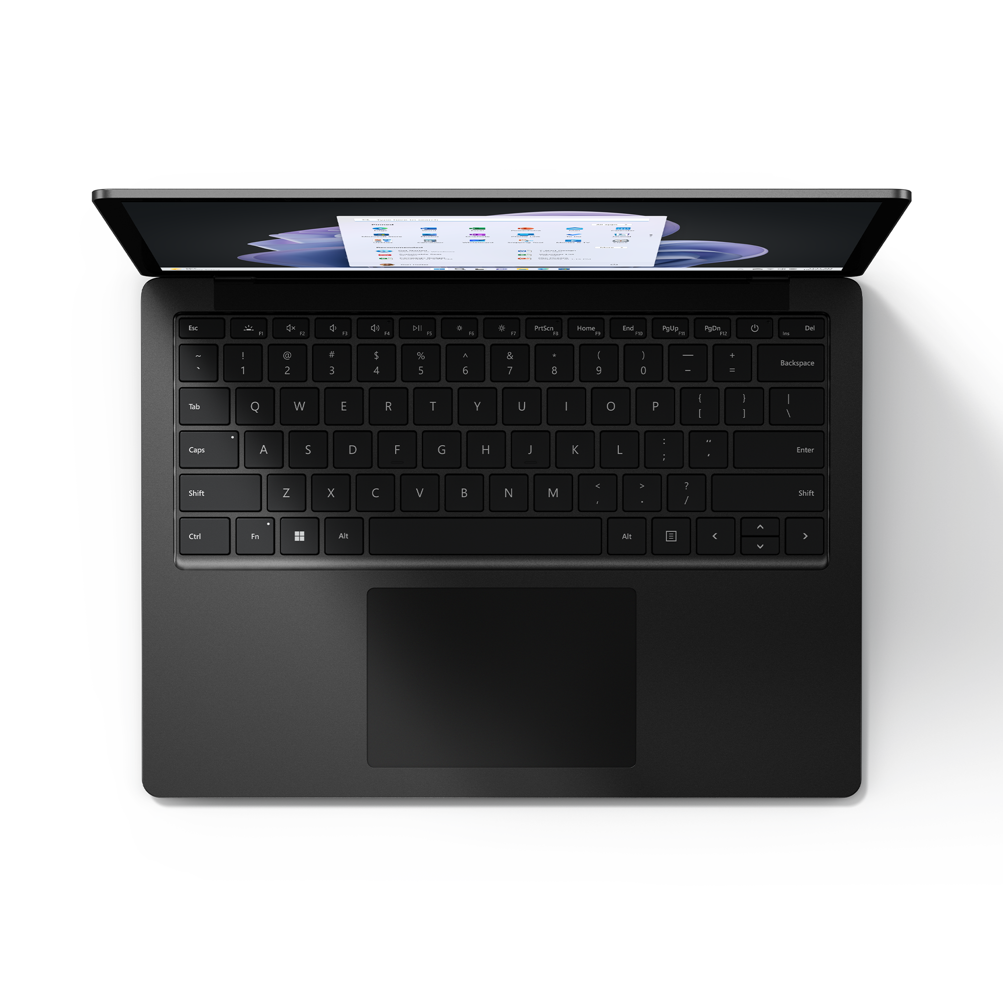 Un portátil negro con la tapa abierta, teclado visible. La pantalla muestra una página web.