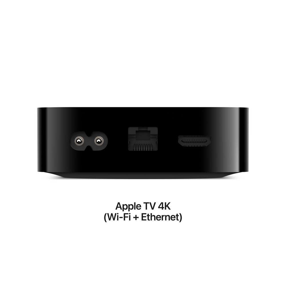 Apple TV 4K negro con puertos de alimentación, Ethernet y HDMI sobre fondo blanco.