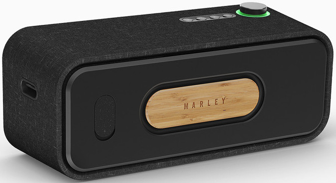 A black speaker with a wooden panel. It has buttons on top and a circular control on the right.