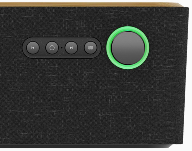 Black speaker with buttons and a green illuminated ring.