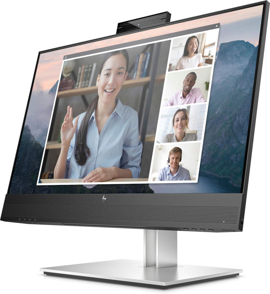 A large computer monitor displaying a video conference with multiple participants.