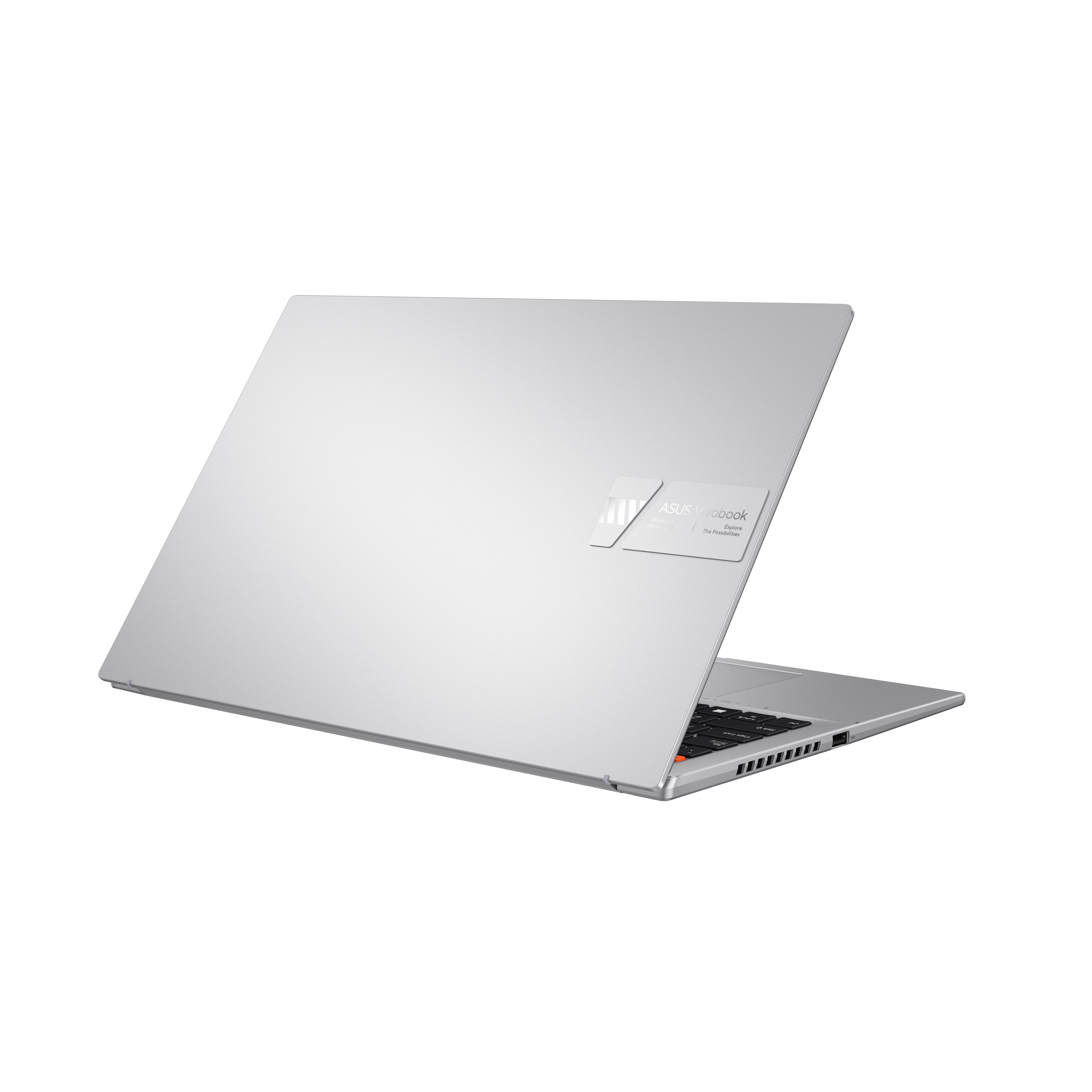Un portátil plateado con el logo de ASUS Vivobook en la parte trasera, sobre un fondo blanco.