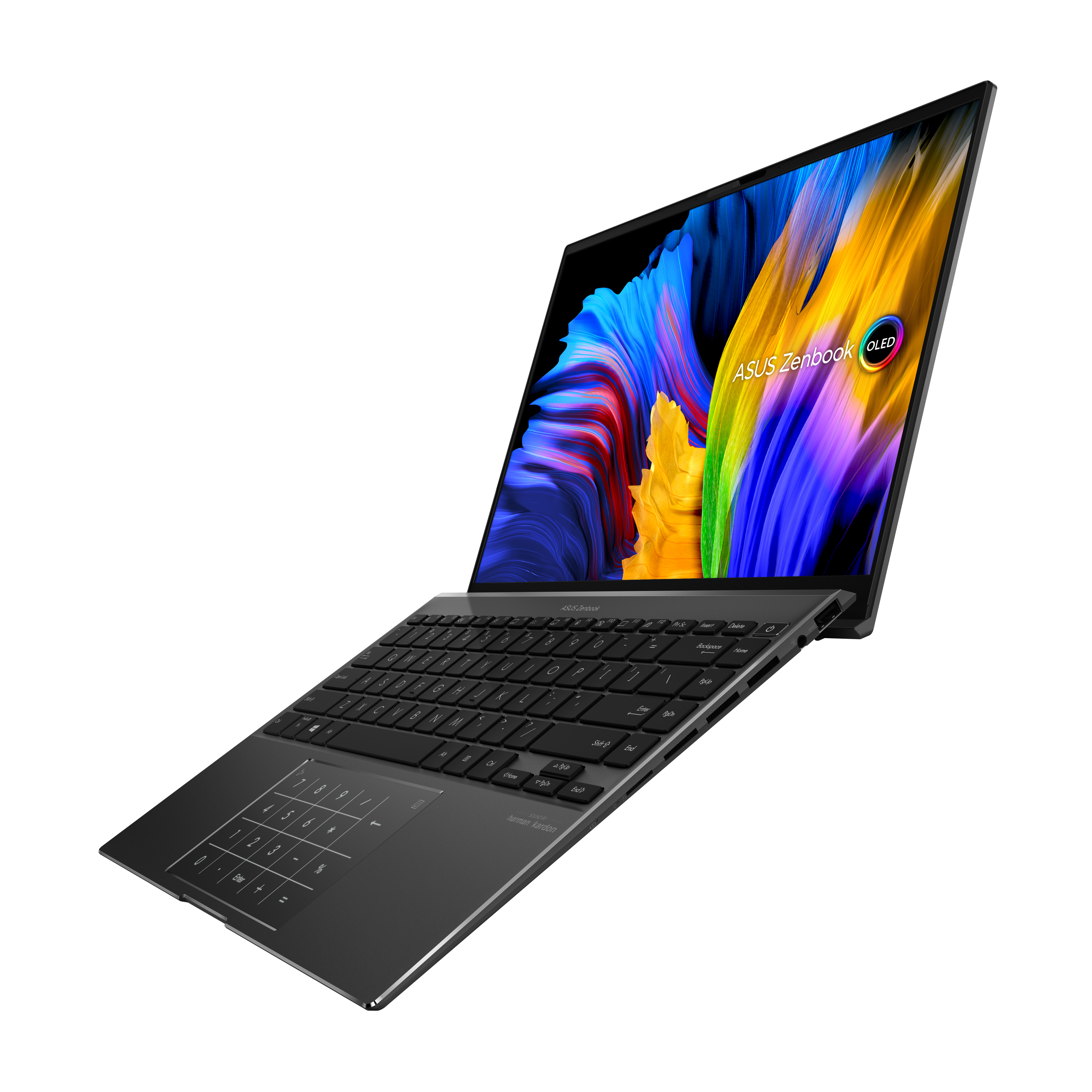 Un portátil negro, abierto, con la pantalla mostrando imágenes coloridas. La marca es ASUS Zenbook.