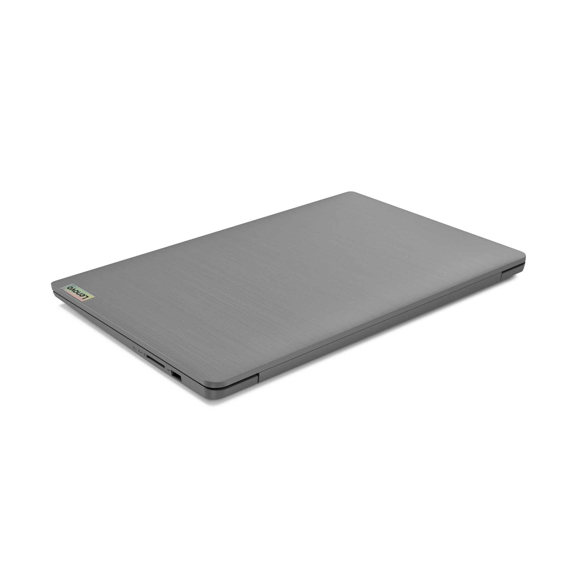 Ein geschlossener grauer Lenovo-Laptop auf einer weißen Oberfläche, leicht nach rechts geneigt.