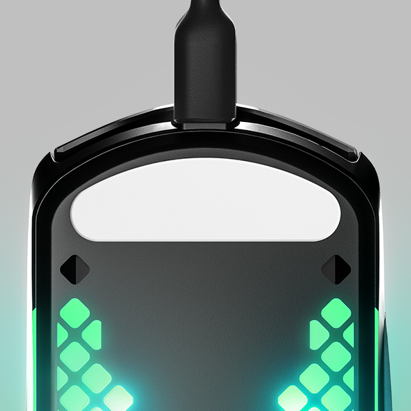 Close-up of a black gaming mouse with green and blue lights. It's plugged in.