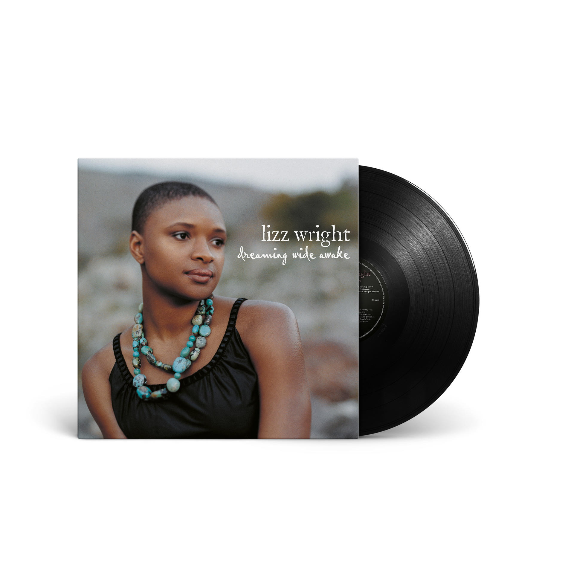 Lizz Wright Albumcover 'Dreaming Wide Awake' mit Vinyl-Schallplatte. Das Cover zeigt eine Frau mit Halskette.