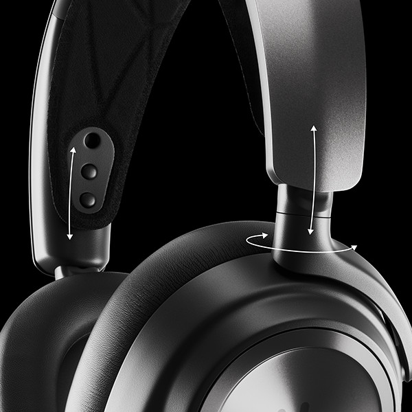 Black headphones, close-up. Adjustments and details visible. Black background.