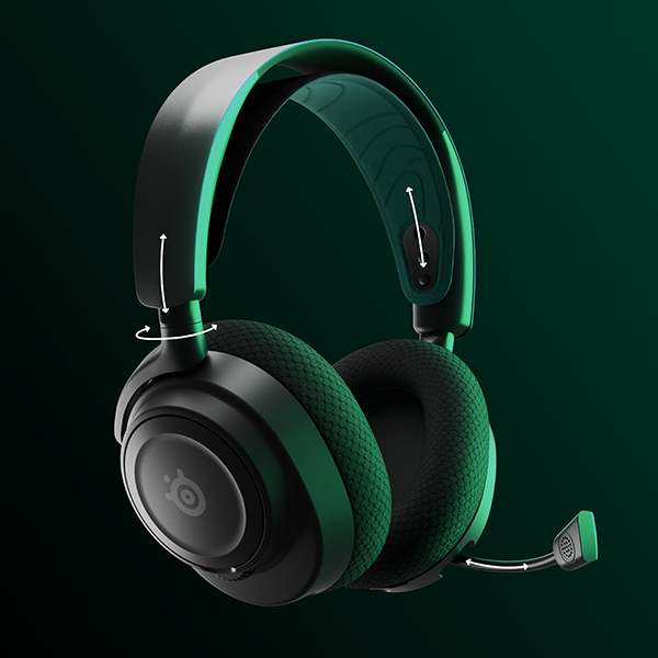 Casque gaming noir et vert avec un microphone.