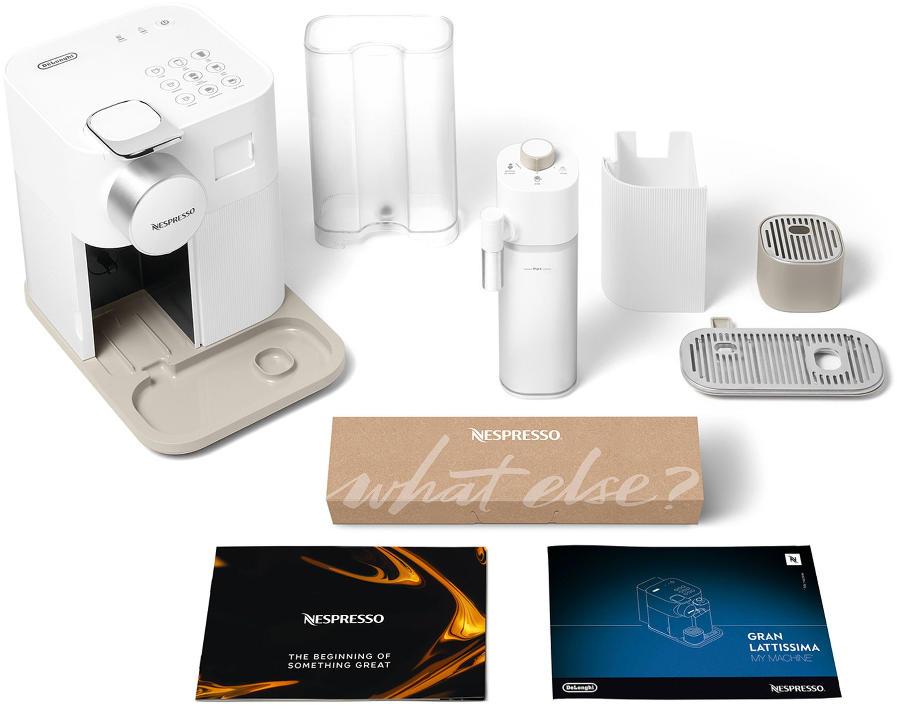 Une machine à café Nespresso avec accessoires, y compris un réservoir d'eau et une boîte 'what else?'.