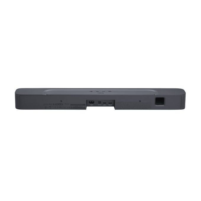 Una barra de sonido gris oscuro, vista trasera. Tiene varios puertos y conexiones en la parte trasera.