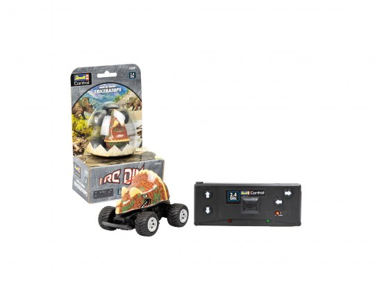 Spielzeug Triceratops Auto und Fernbedienung, in einer Box. Weißer Hintergrund.