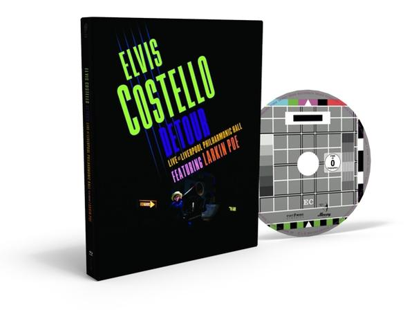 Elvis Costello Albumcover und CD, schwarzes Cover mit grünem und weißem Text.