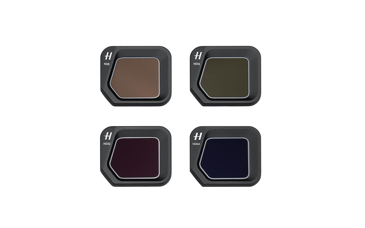Vier schwarze ND-Filterrahmen mit braunen, olivfarbenen, lila und blauen Filtern, beschriftet mit ND8, ND16, ND32 und ND64.