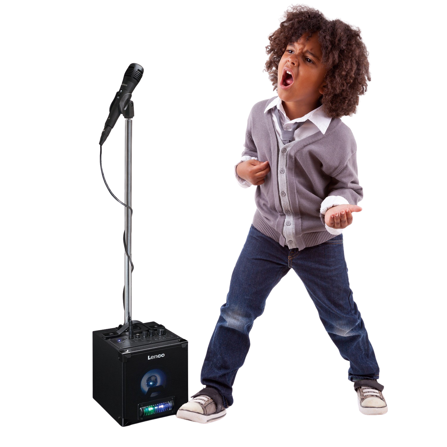 A young boy singing into a microphone.