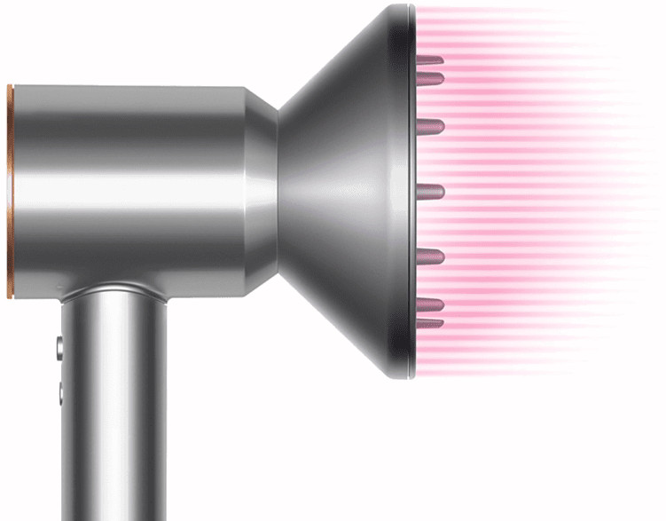 Silver hair dryer with a diffuser. Pink air streams are coming out of the diffuser.