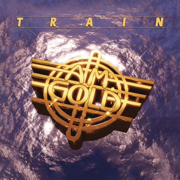 Album borító: Arany logó kék texturált háttéren. 'Train' és 'AM Gold'.