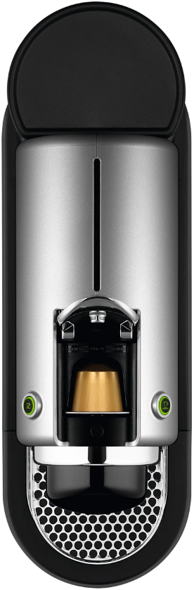 Fekete-ezüst Nespresso kávéfőző, felülnézet, kávékapszulával.