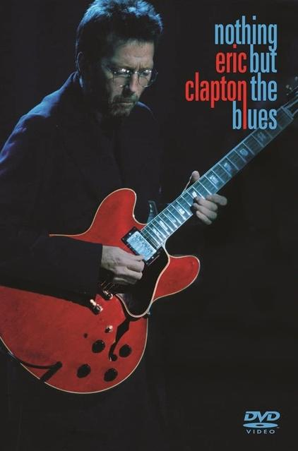 DVD-Cover mit Eric Clapton, der Gitarre spielt, und roter Gitarre im dunklen Hintergrund.