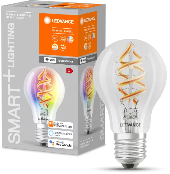 Eine LEDVANCE Smart-Glühbirne mit farbigem Filament wird neben ihrer Verpackung angezeigt. Die Glühbirne ist klar mit einem silbernen Sockel.